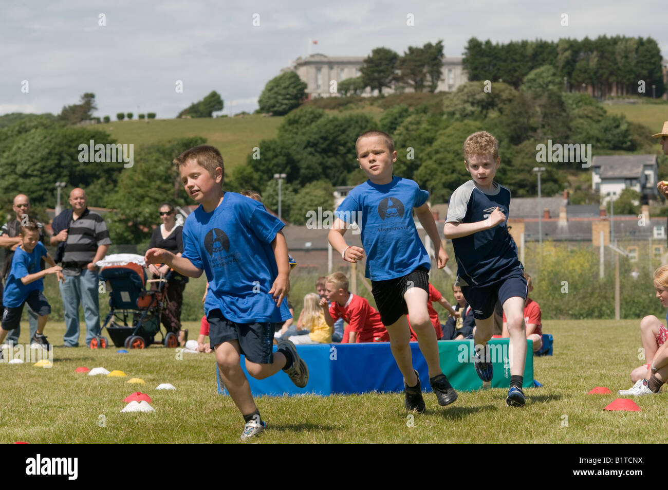Children competing at school sports day Aberystwyth welsh language primary school, Wales UK Stock Photo