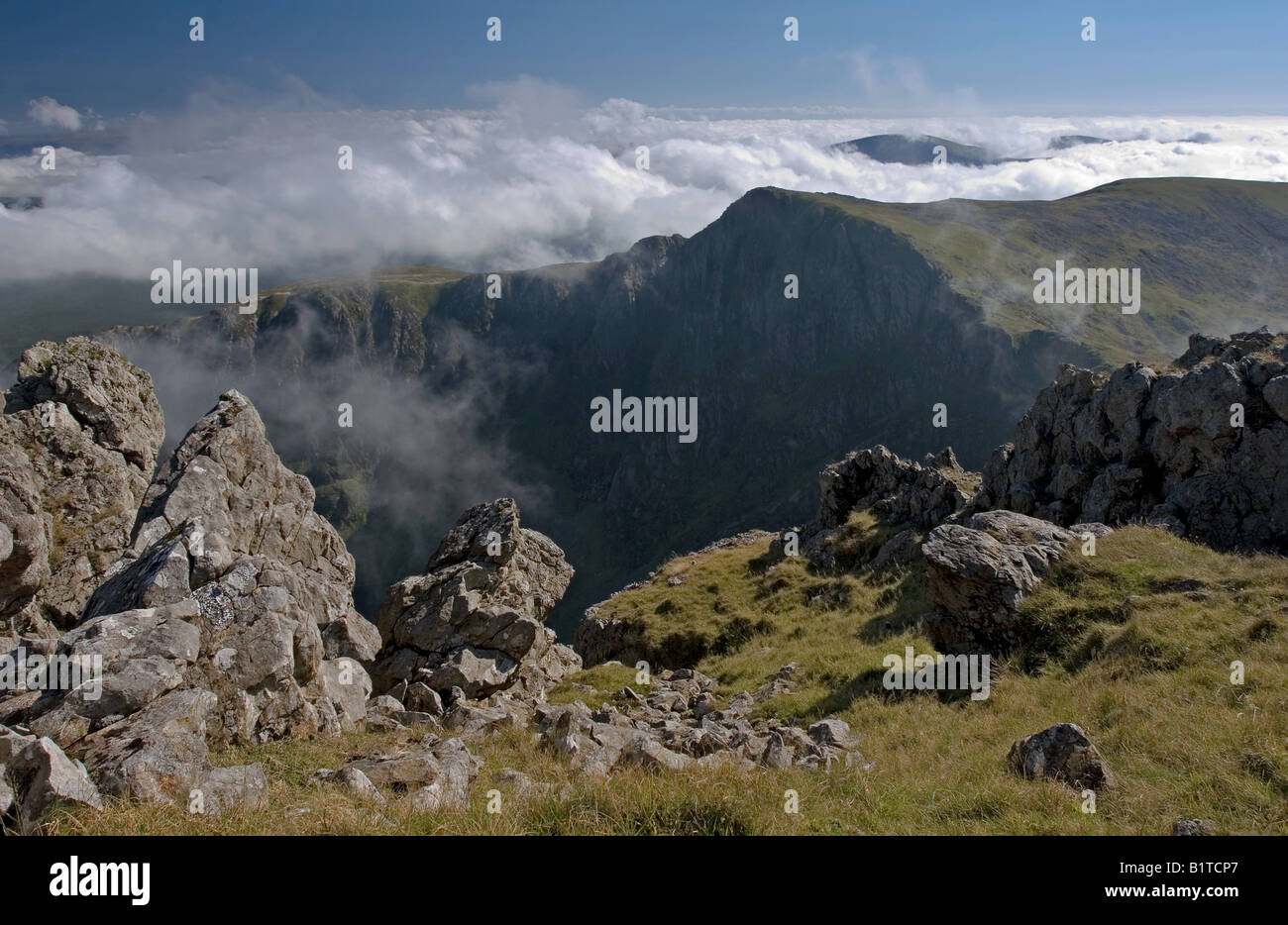 Cadair Idris in temperature inversion with Craig Cau in the middle distance Stock Photo