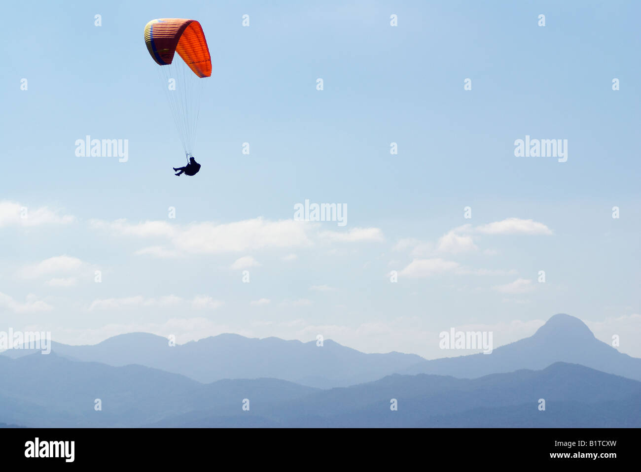 Paraglider flying over the Atlantic Rainforest Santa Catarina Brazil