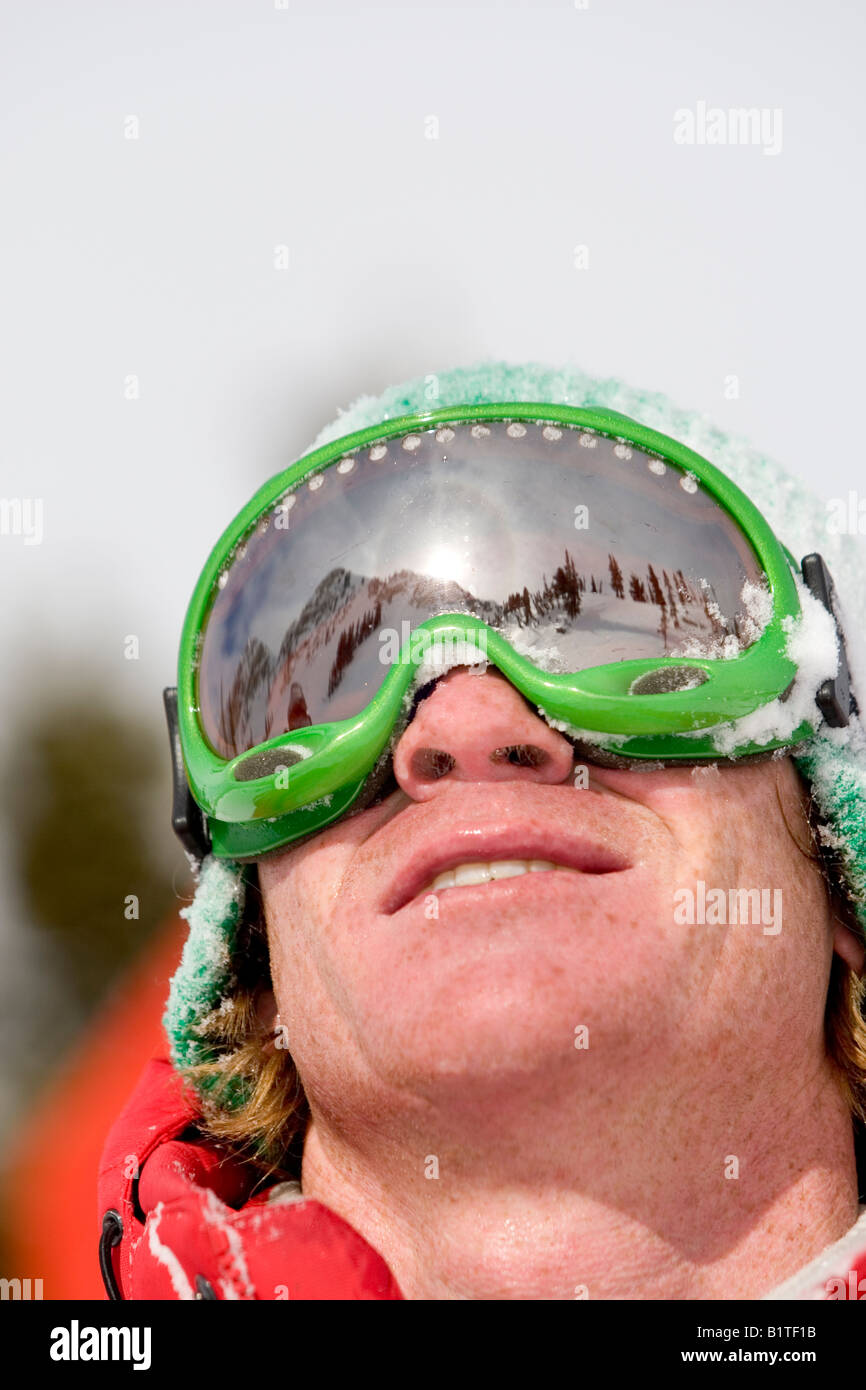 skier wearing goggle with reflection of mountains Stock Photo Alamy