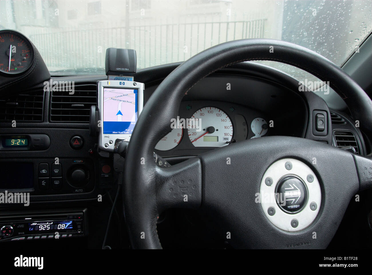 Car With a PDA Sat Nav on the Dashboard Stock Photo