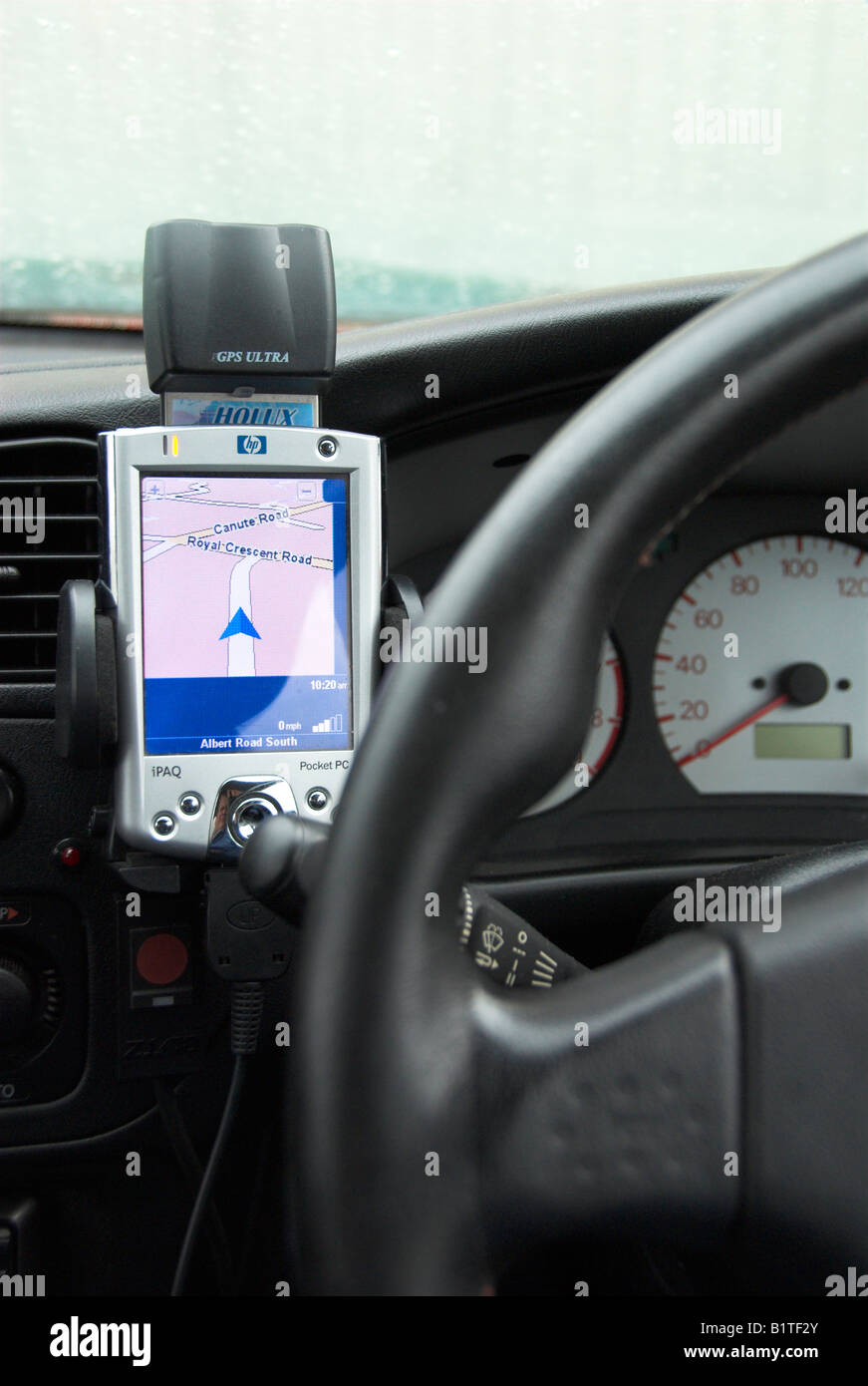 Car With a PDA Sat Nav on the Dashboard Stock Photo