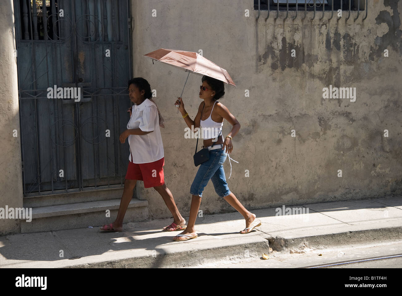 Women on the street of Santiago de Cuba Stock Photo Alamy