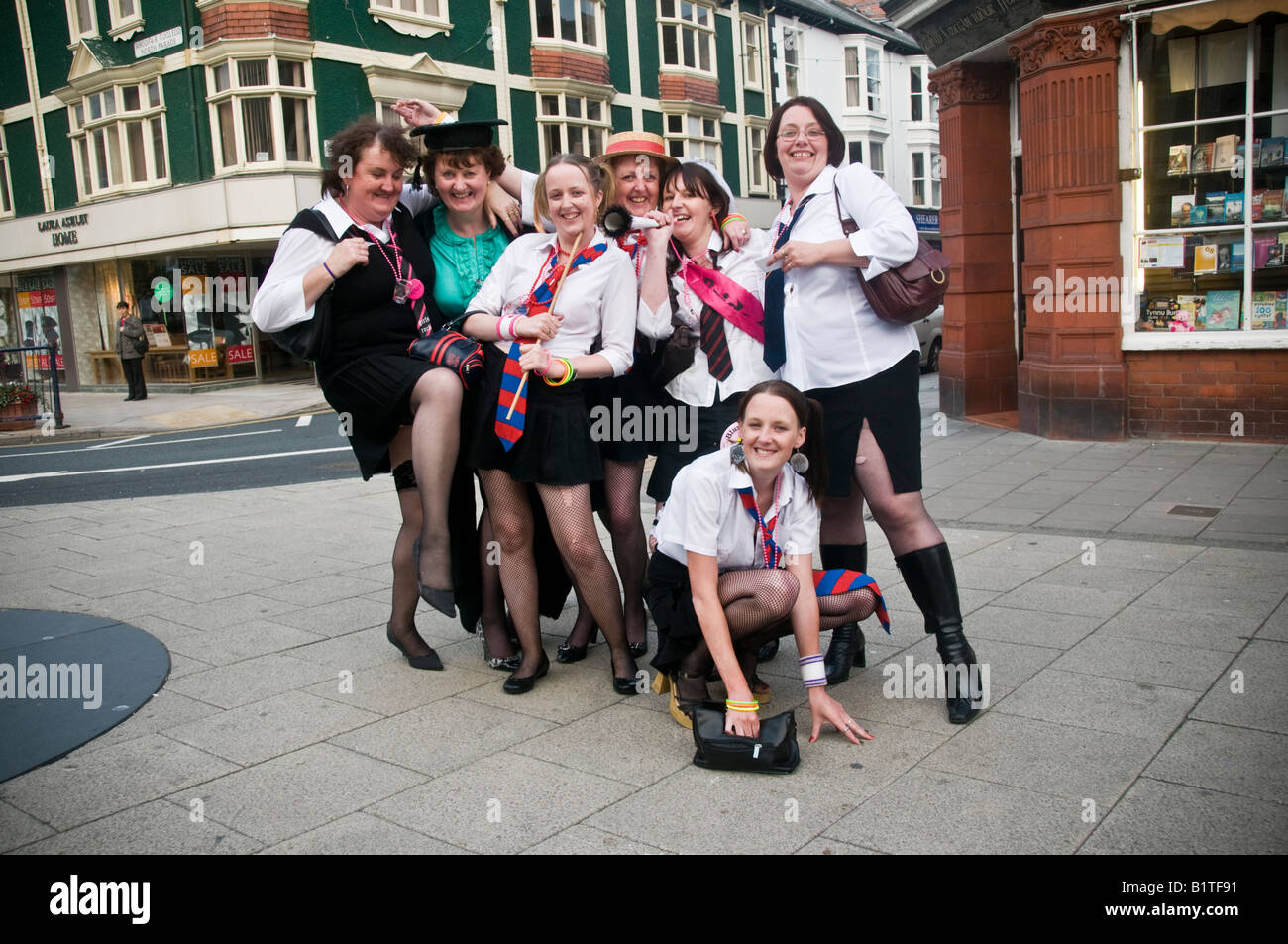 group of women in fancy dress as naughty schoolgirls on a hen night party in Aberystwyth Wales UK Stock Photo Alamy