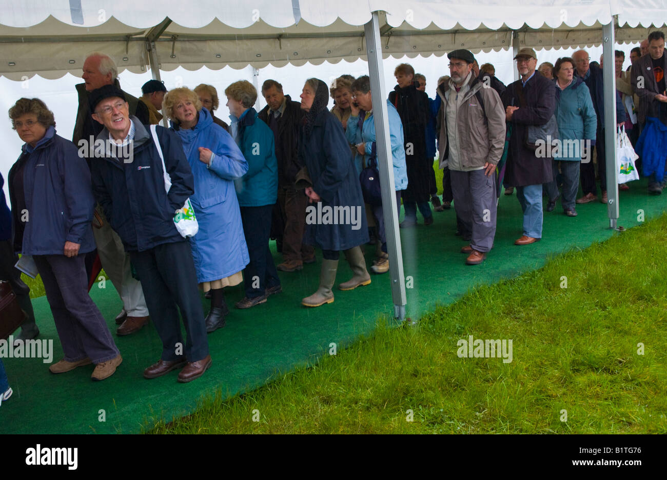 People queue on covered walkway at The Guardian Hay Festival 2008 Hay on Wye Powys Wales UK EU Stock Photo