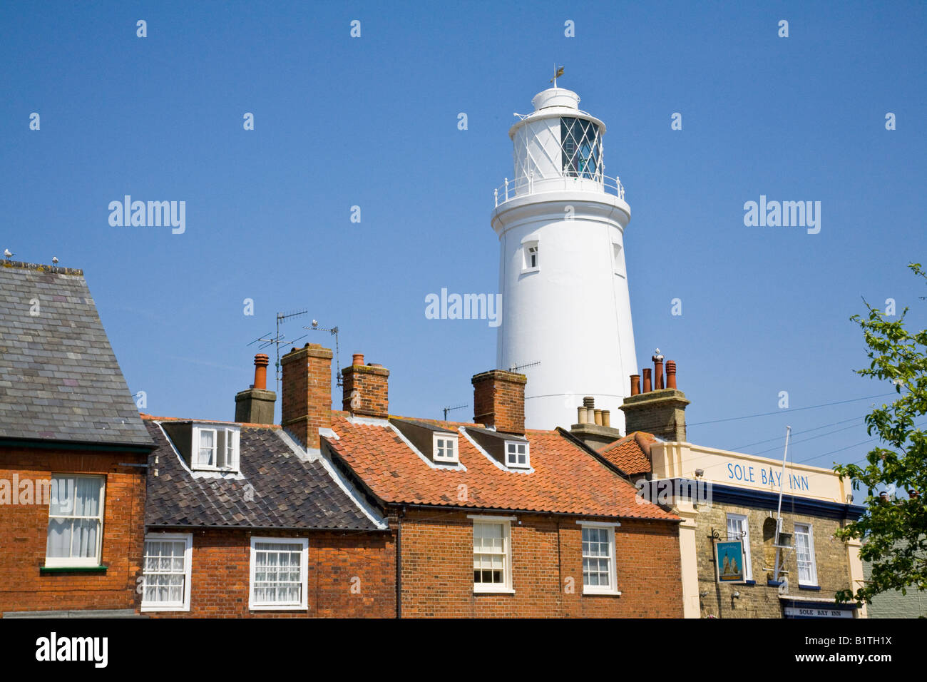 Lighthouse at Southwold Suffolk England showing the Sole Bay Inn Stock Photo