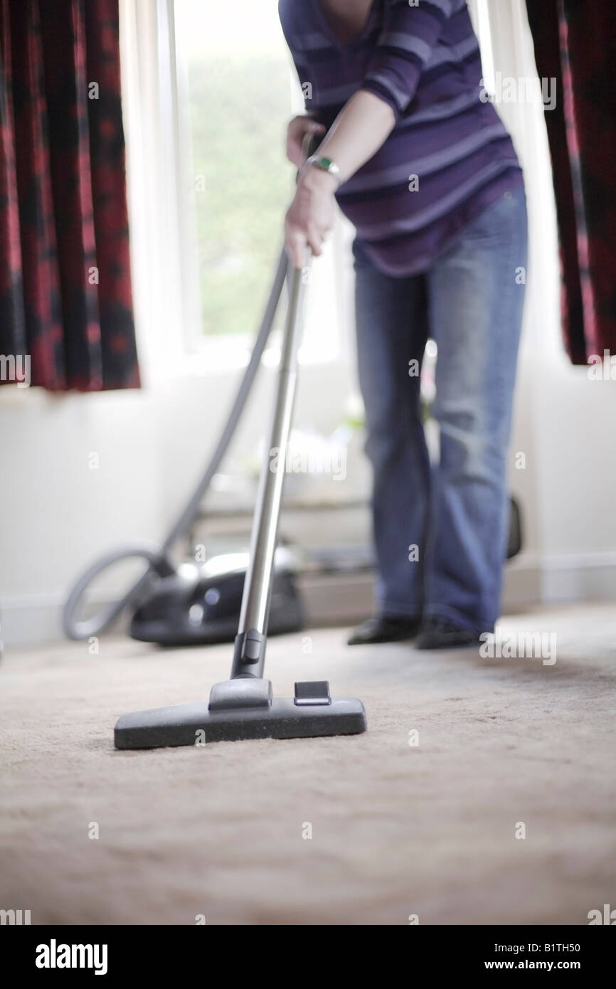Pregnant Woman Hoovering Stock Photo Alamy