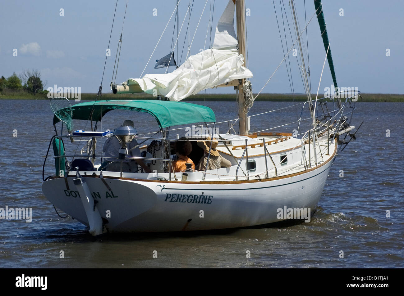sailboat heading out on the Apalachicola River Apalachicola Florida Stock Photo