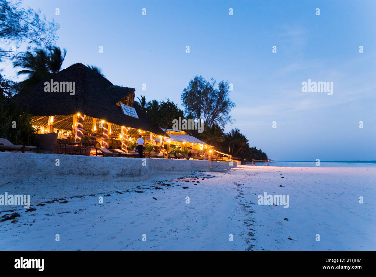 Beach bar in the evening The Sands at Nomad Diani Beach Kenya Stock Photo