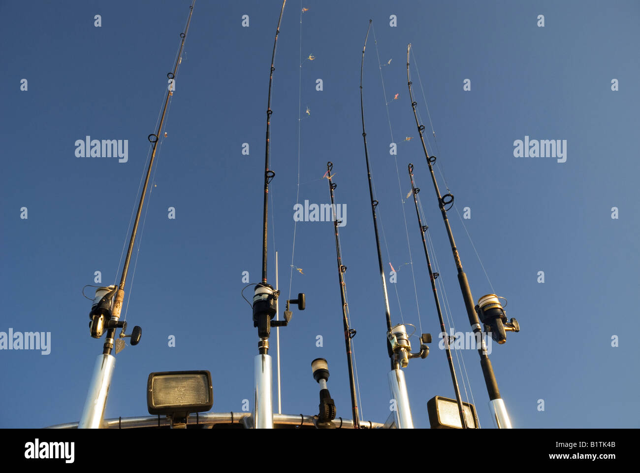 spin casting rod and reel outfits adorn fishing boat out of