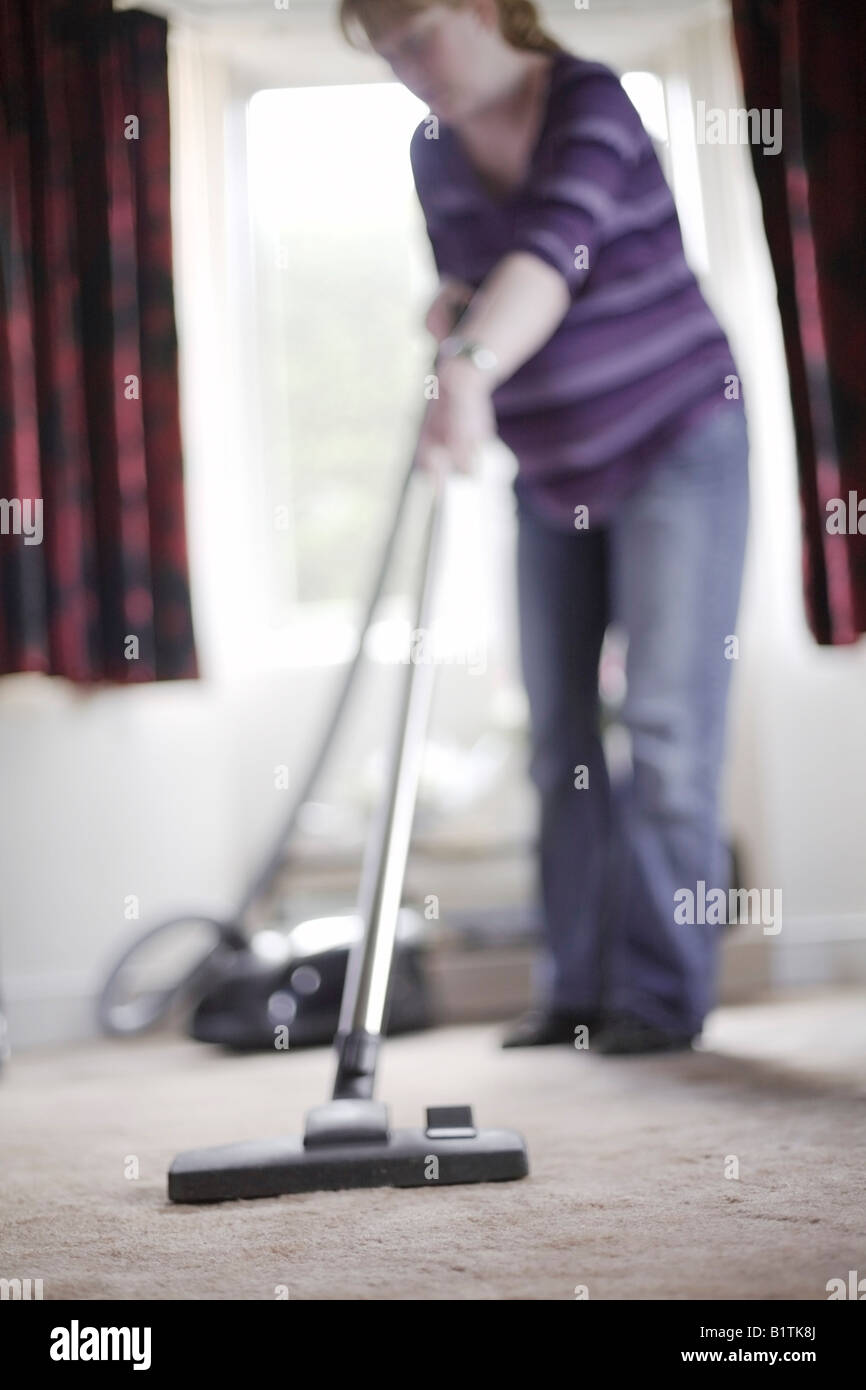 Pregnant Woman Hoovering Stock Photo Alamy