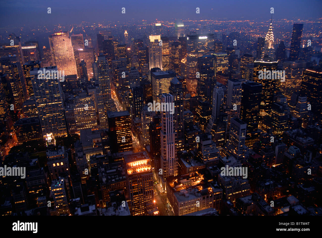 New York City skyline viewed at night from the Empire State Building ...