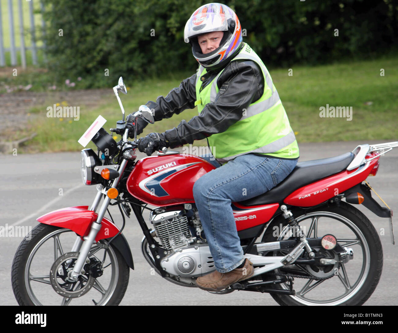 A man on his cbt motorcycle test Stock Photo - Alamy