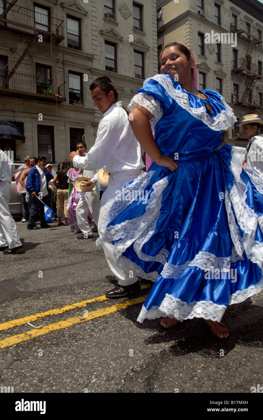 El Salvadorian folk dancers perform in a flower parade on Central Park West in New York NY Stock Photo