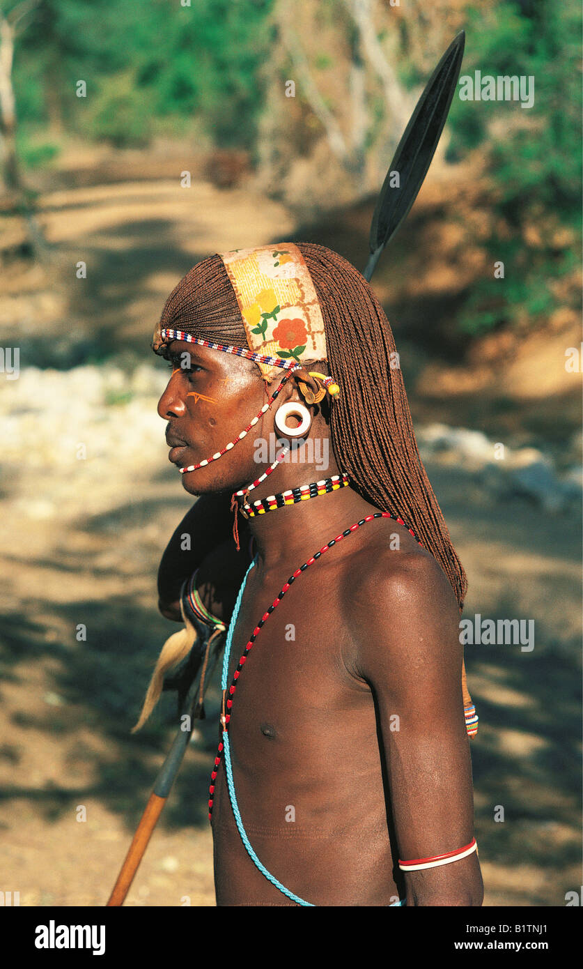 Profile of Samburu moran warrior with traditional beads long hair and ivory  earplugs Northern Kenya East Africa Stock Photo - Alamy
