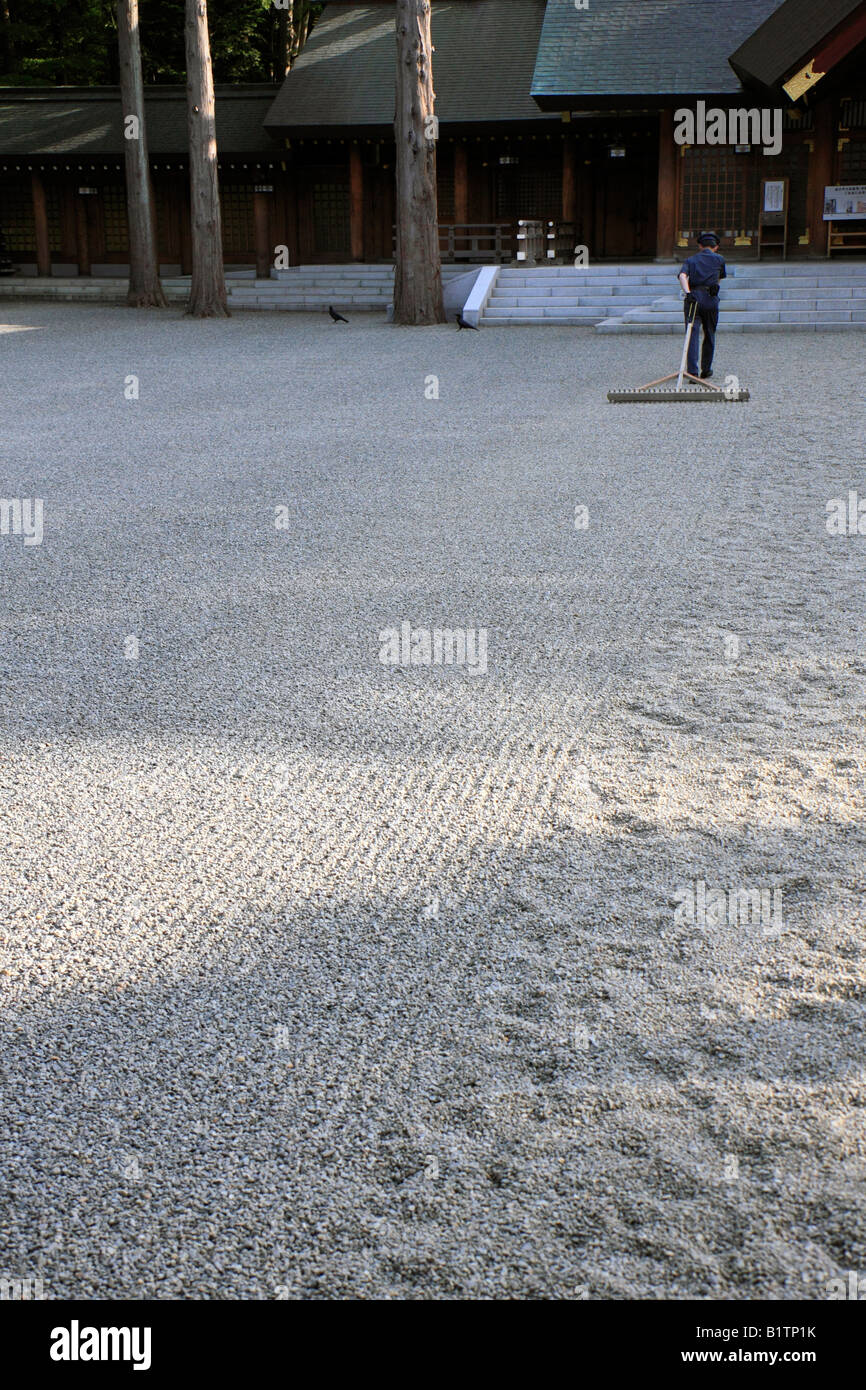 Sand Racking Japan Security guard raking gravel at a shinto shrine in Sapporo, Japan Stock ...