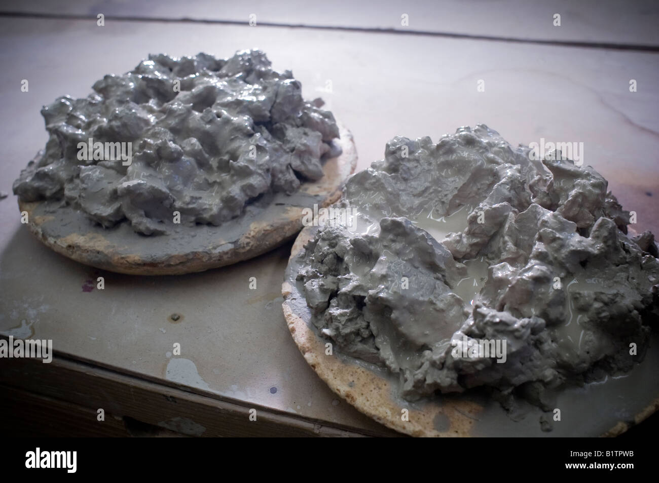 Stoneware clay being reclaimed on plaster bats in a pottery studio
