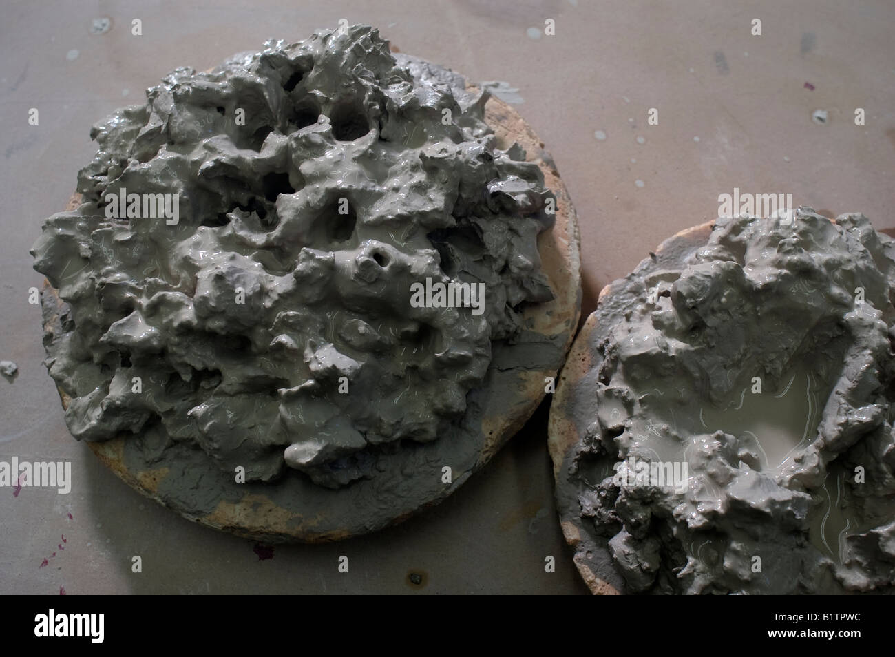 Stoneware clay being reclaimed on plaster bats in a pottery studio