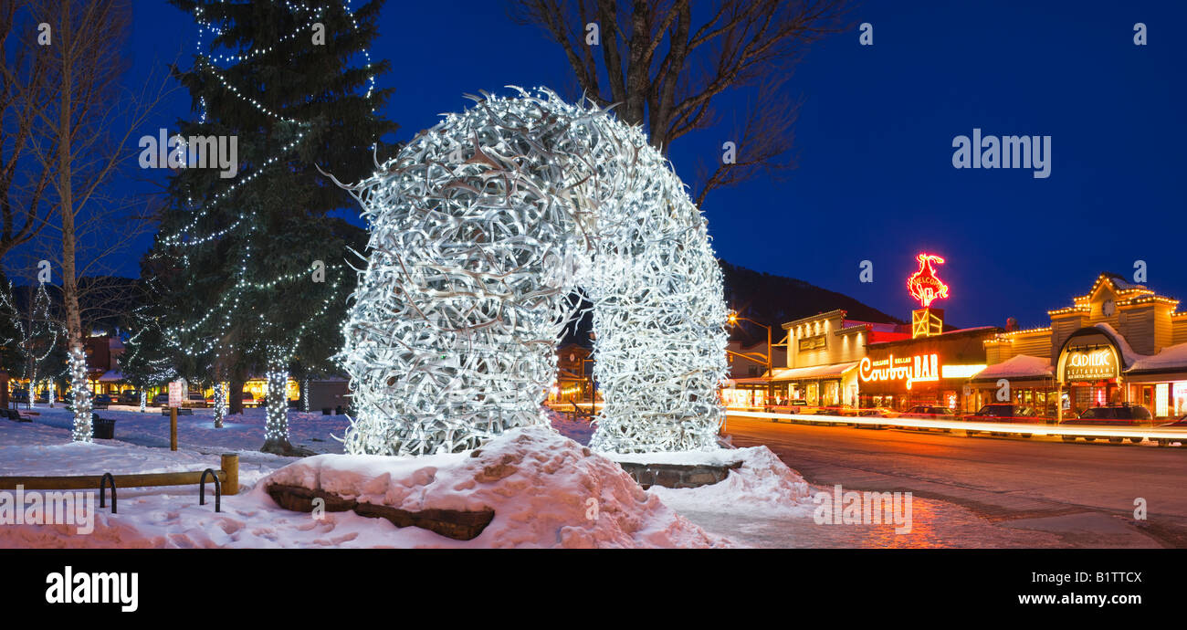 One of the antler arches in the centre of Jackson Hole with the Cowboy Bar in the background, Wyoming, USA. Stock Photo