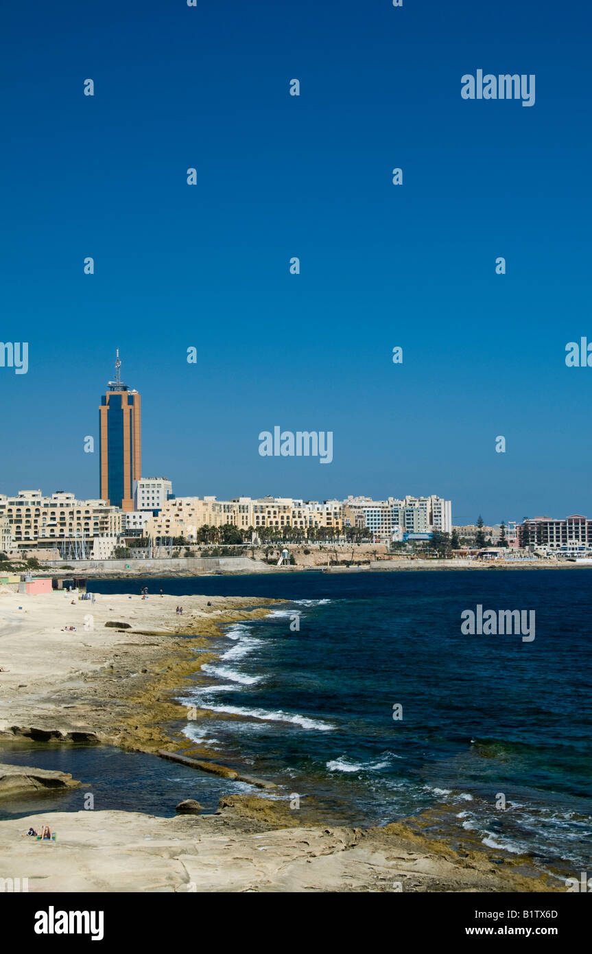 The coastline of Sliema, Malta showing limestone carved beach and the