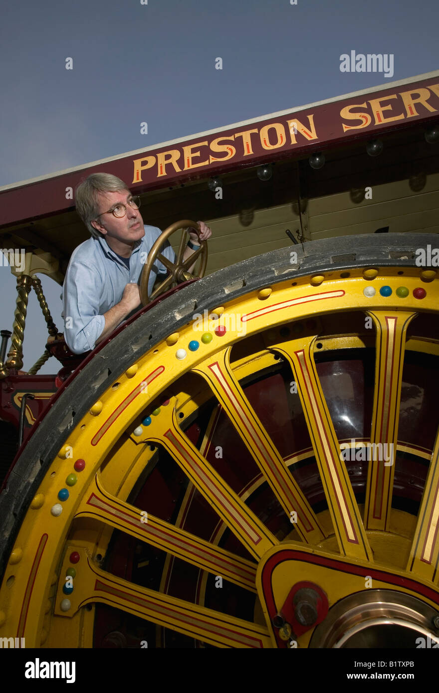Fair Ground traction Engine driver at work Stock Photo Alamy