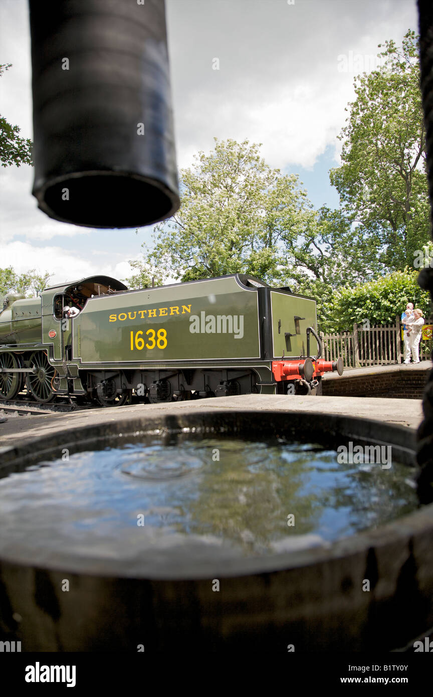 Steam Train Filling Water Stock Photos & Steam Train Filling Water