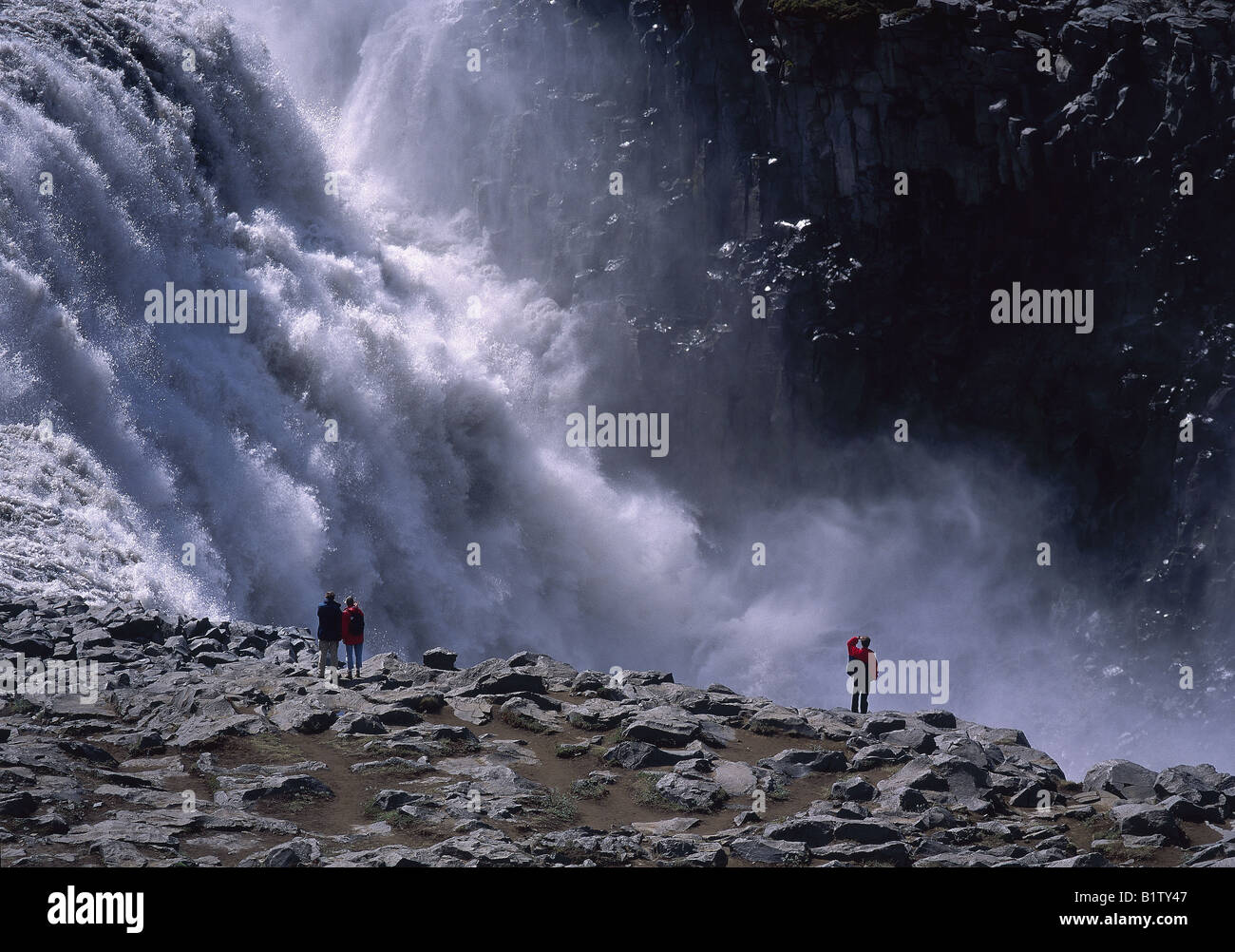 Tourists Watching Dettifoss Waterfall, Northern Iceland Stock Photo