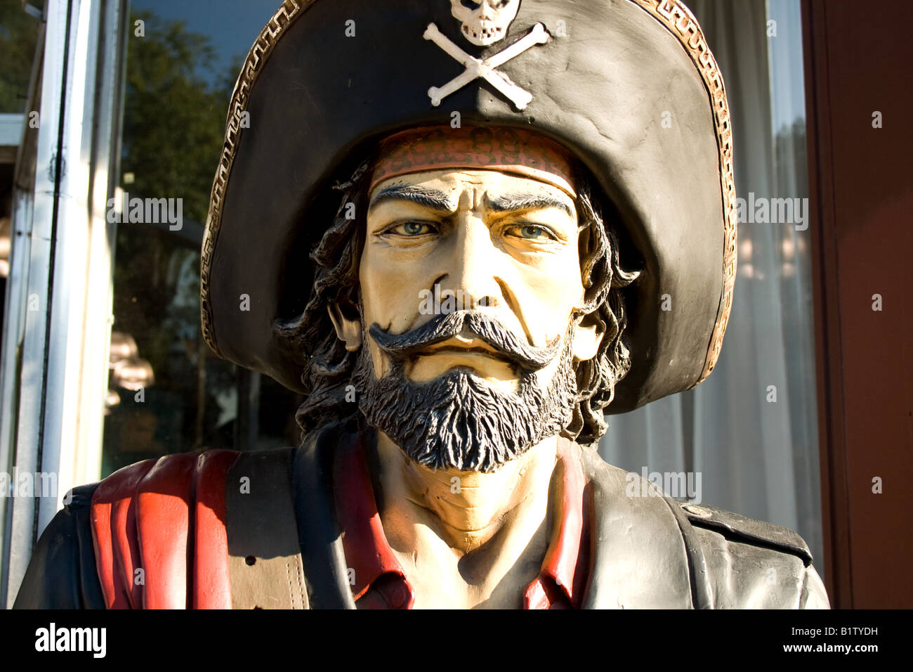 Head of wooden pirate statue in front of a store in St. Augustine, Florida Stock Photo