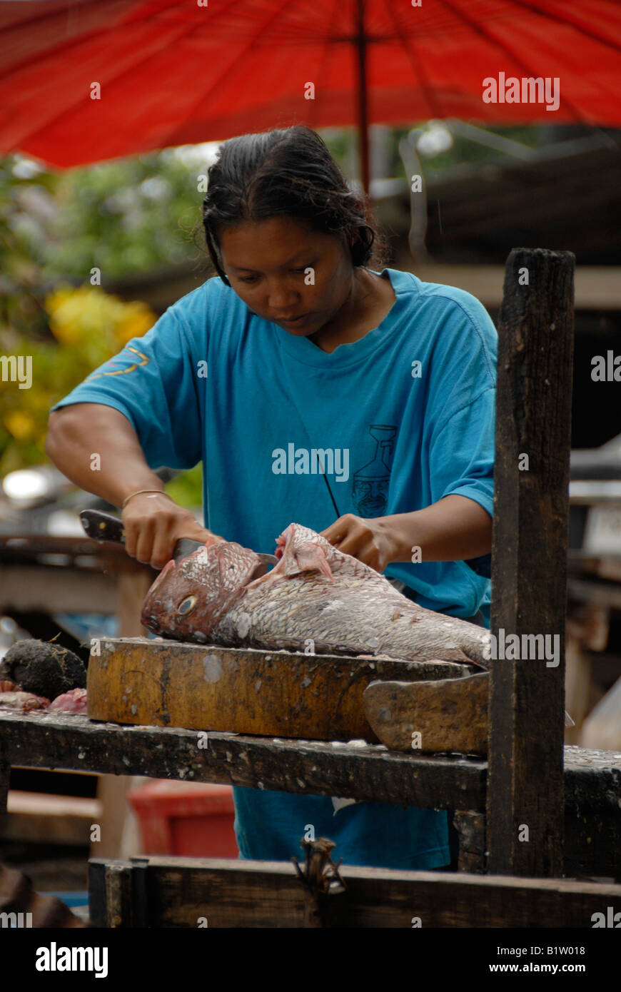 rawai beach fish market, sea gypsy cleaning fish phuket thailand Stock