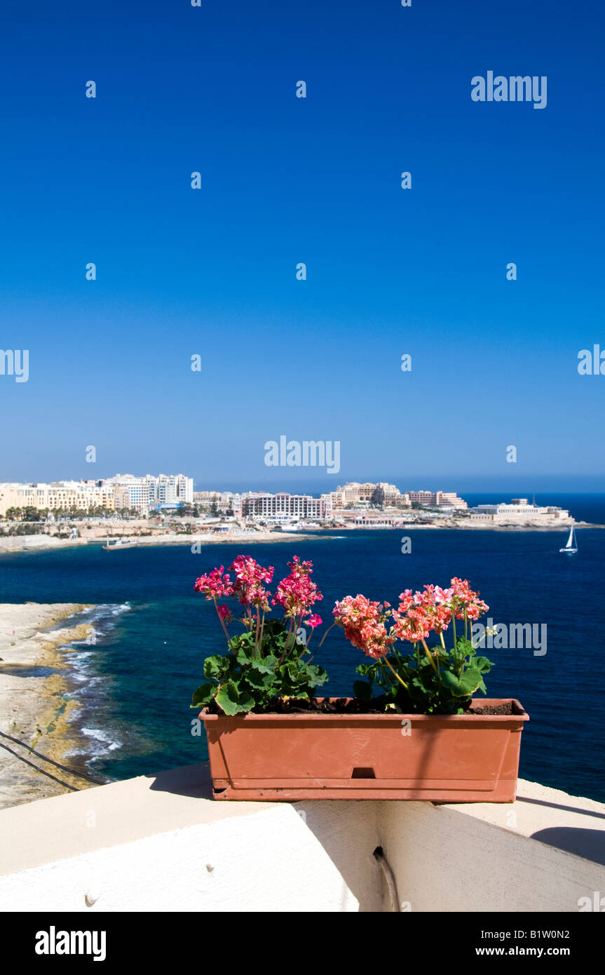 The coastline of Sliema, Malta showing limestone carved beach and the