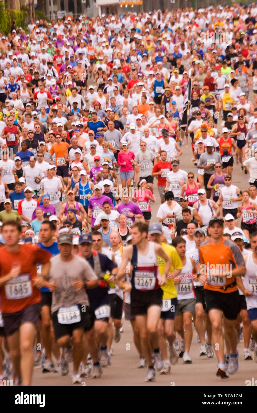 Thousands of participants at the start begin the 26 mile run of a  marathon race. Stock Photo