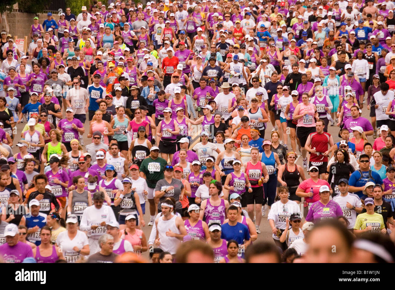 Thousands of participants at the start begin the 26 mile run of a  marathon race. Stock Photo