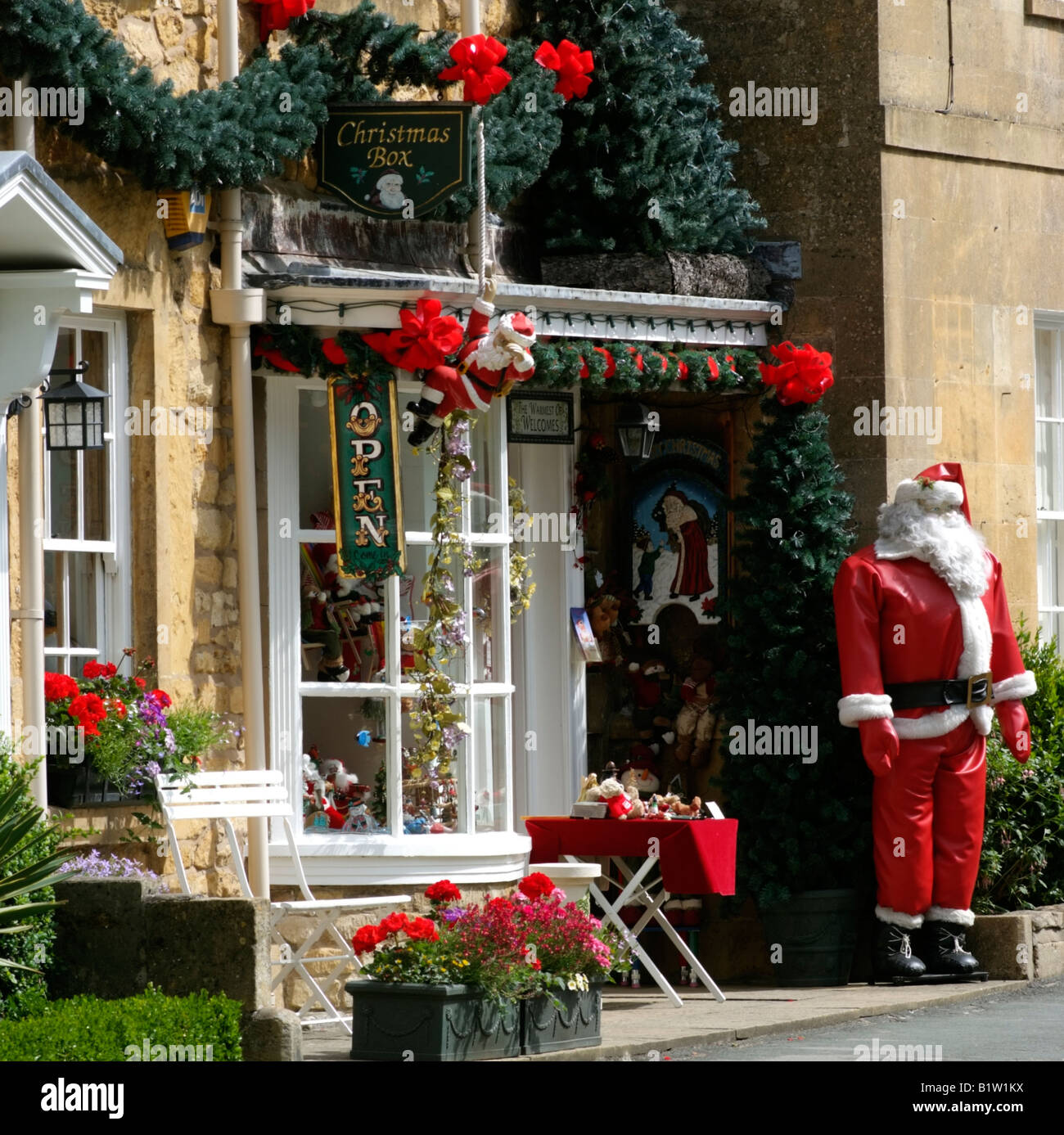 Father Christmas outside a Christmas accessories shop in the Cotswolds at Broadway
