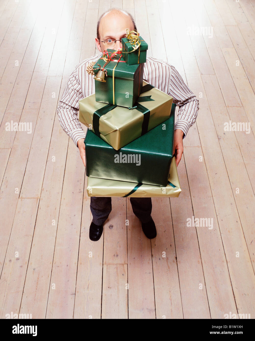 Man holding wrapped up gift Stock Photo