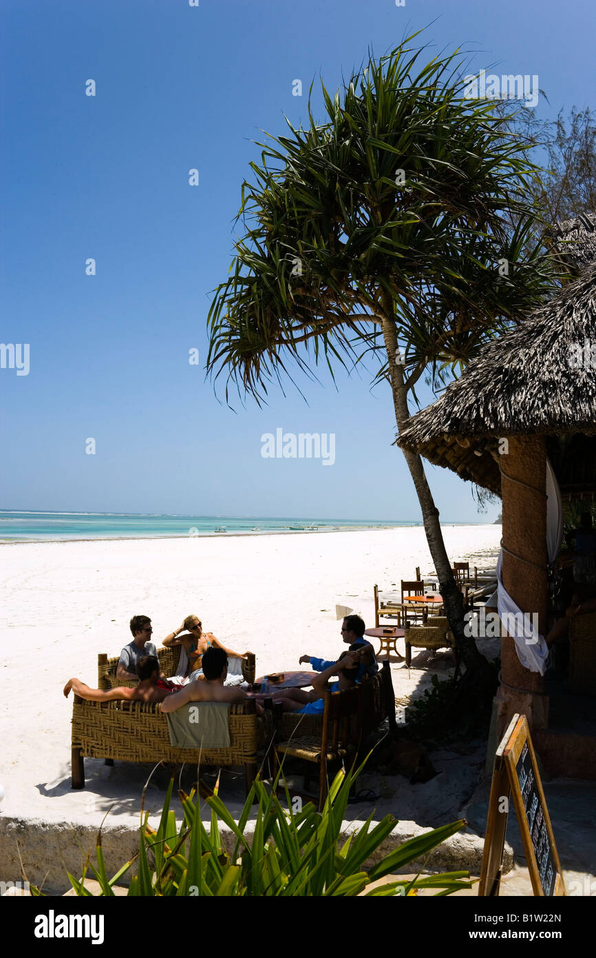 Guests sitting in a beach bar The Sands at Nomad Diani Beach Kenya Stock Photo