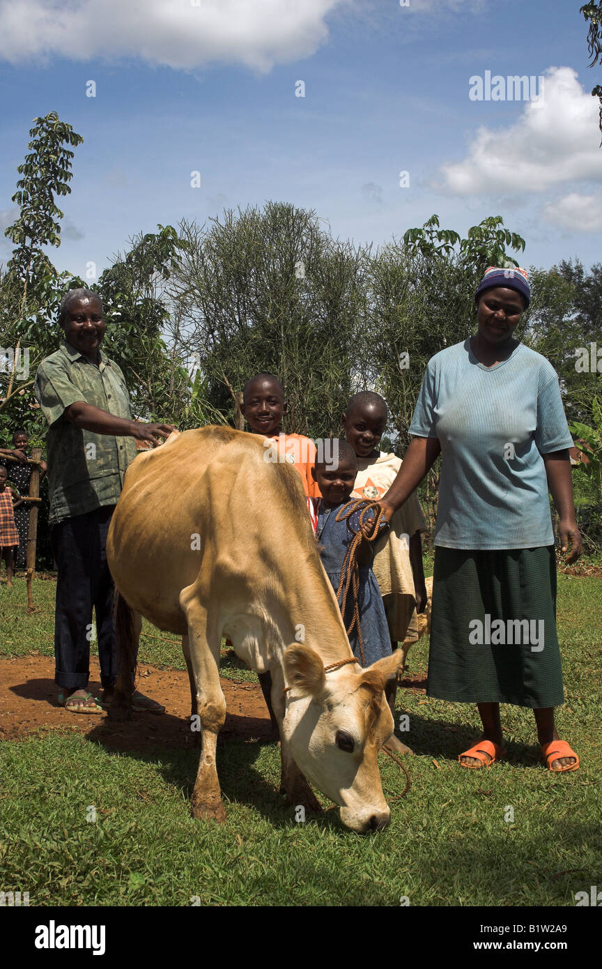 Family with their dairy cow on rope lead Kenya Africa Stock Photo Alamy