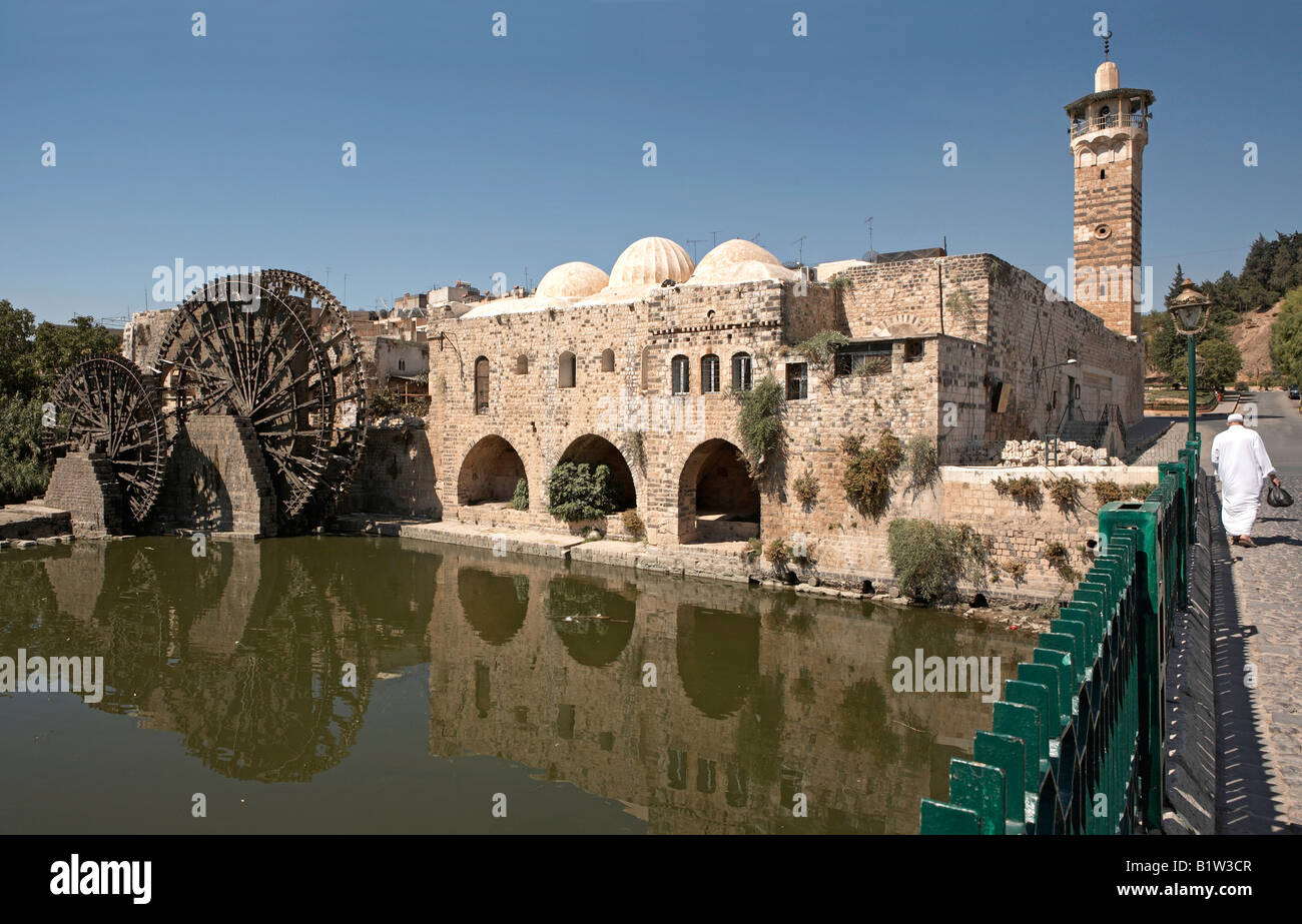 Hama Syria Noria wooden waterwheel and Nur Ad-Din mosque Stock Photo