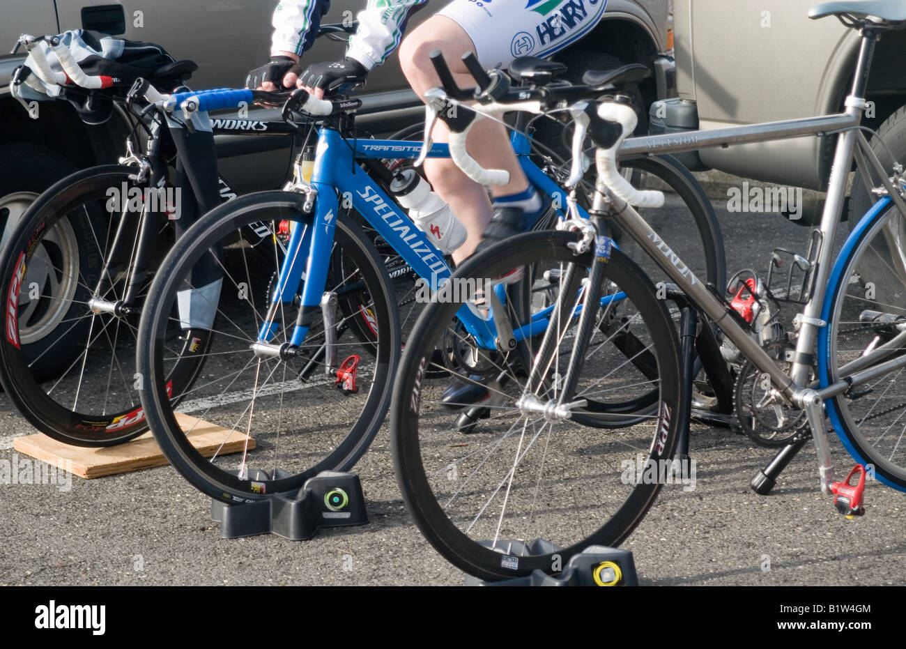 Racer on a stationary trainer warming up before bike race Stock Photo ...