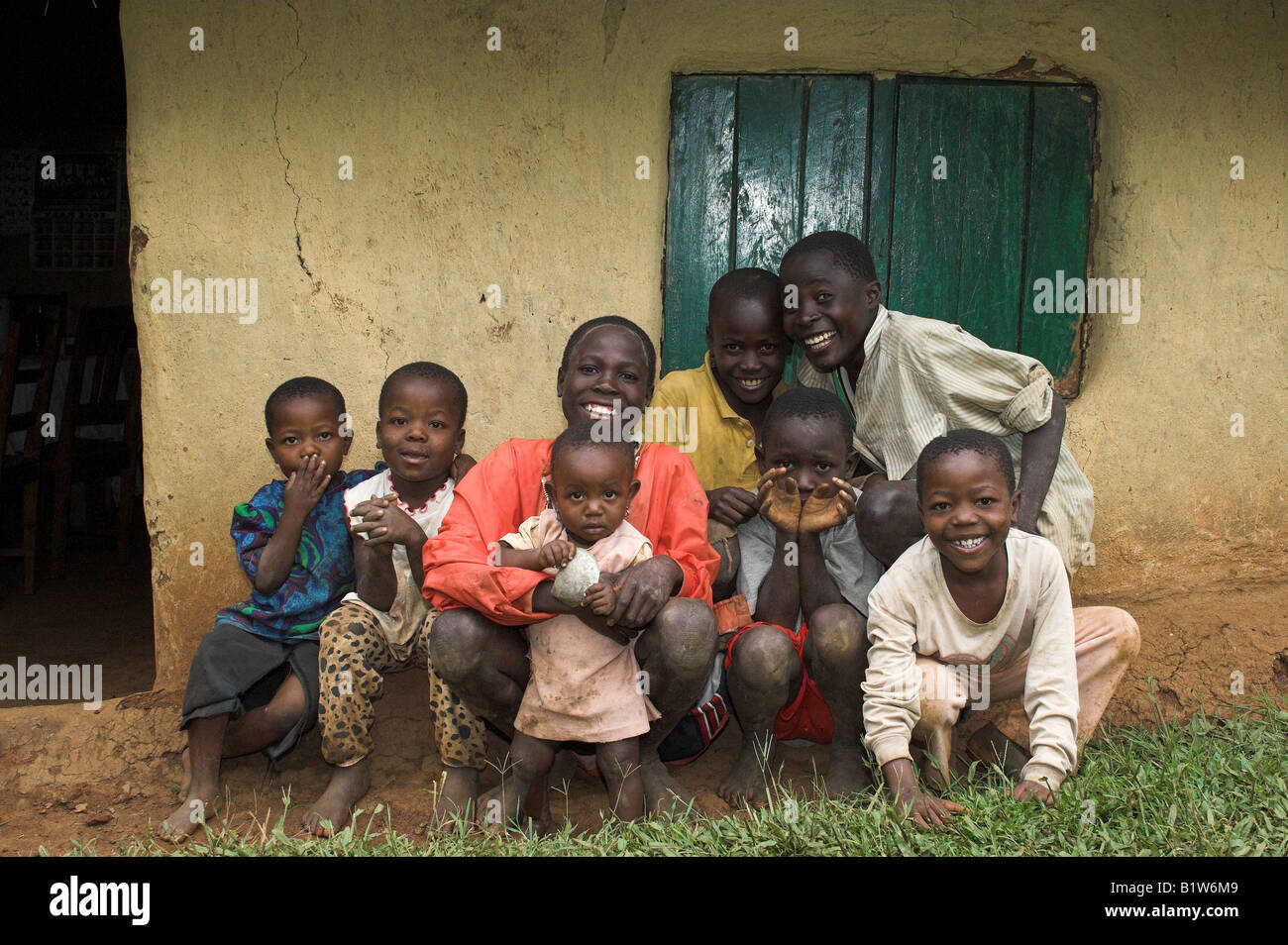 African children ouside mud hut smiling at camera Kenya Africa Stock ...