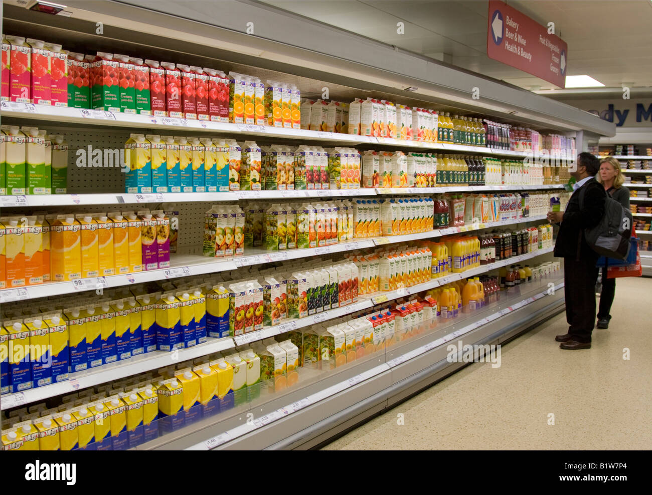 Fruit juice chiller - Tesco Express Supermarket - Goodge Street - London Stock Photo