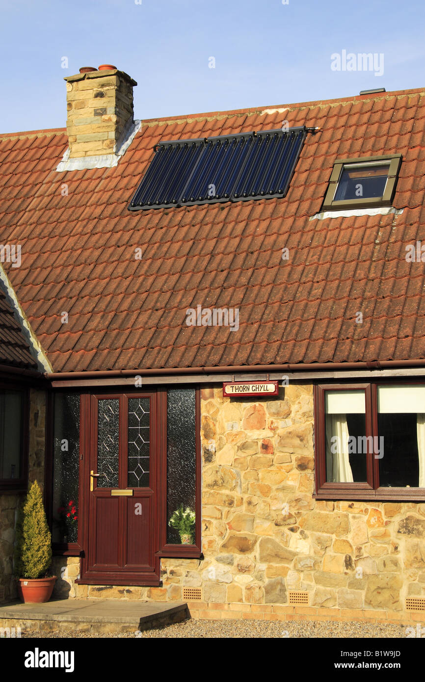 Solar heating panels for hot water on roof of house near Bedale