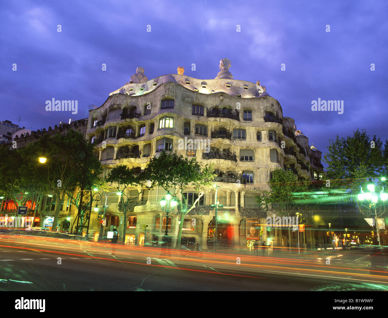 Antoni Gaudi's Casa Mila or La Pedrera building at sunset / night Passeig de Gracia Eixample Barcelona Catalunya Spain Stock Photo