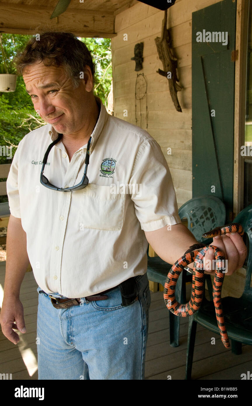 Guide holds a mud snake (Farancia abacura), Dr. Wagner's Honey Island Swamp Tours, Saint Tammany Parish, Northshore, Louisiana. Stock Photo