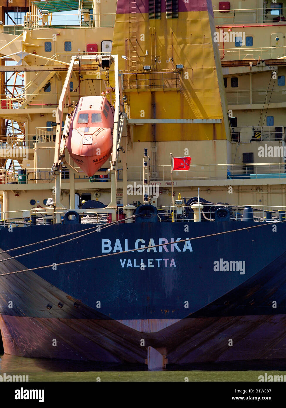 Rear of a Malta registered ocean going cargo ship in the port of Antwerp Belgium Stock Photo