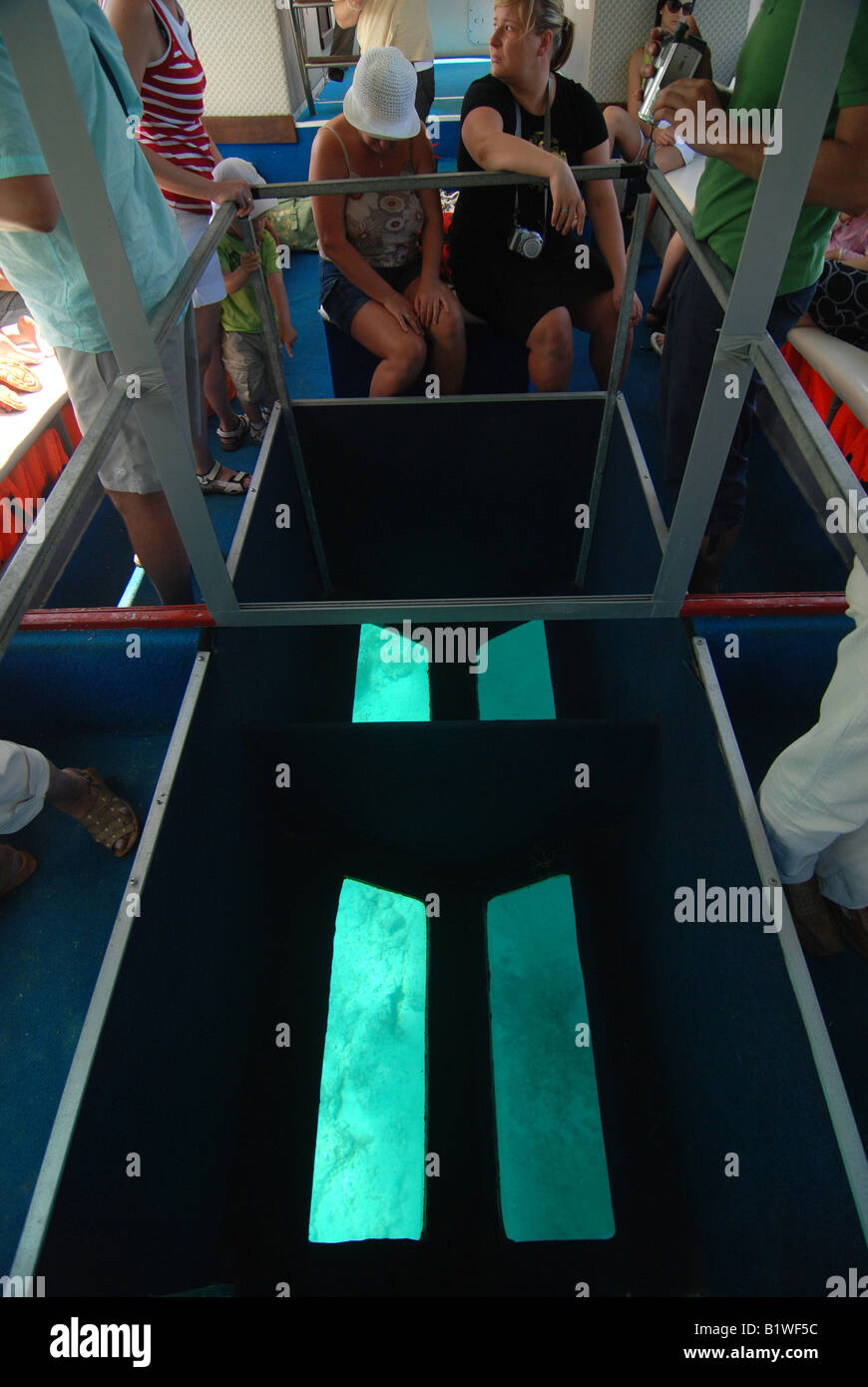 Glass bottom boat cruise along the rocky coast of greek island of Corfu (Ionian Sea) Stock Photo