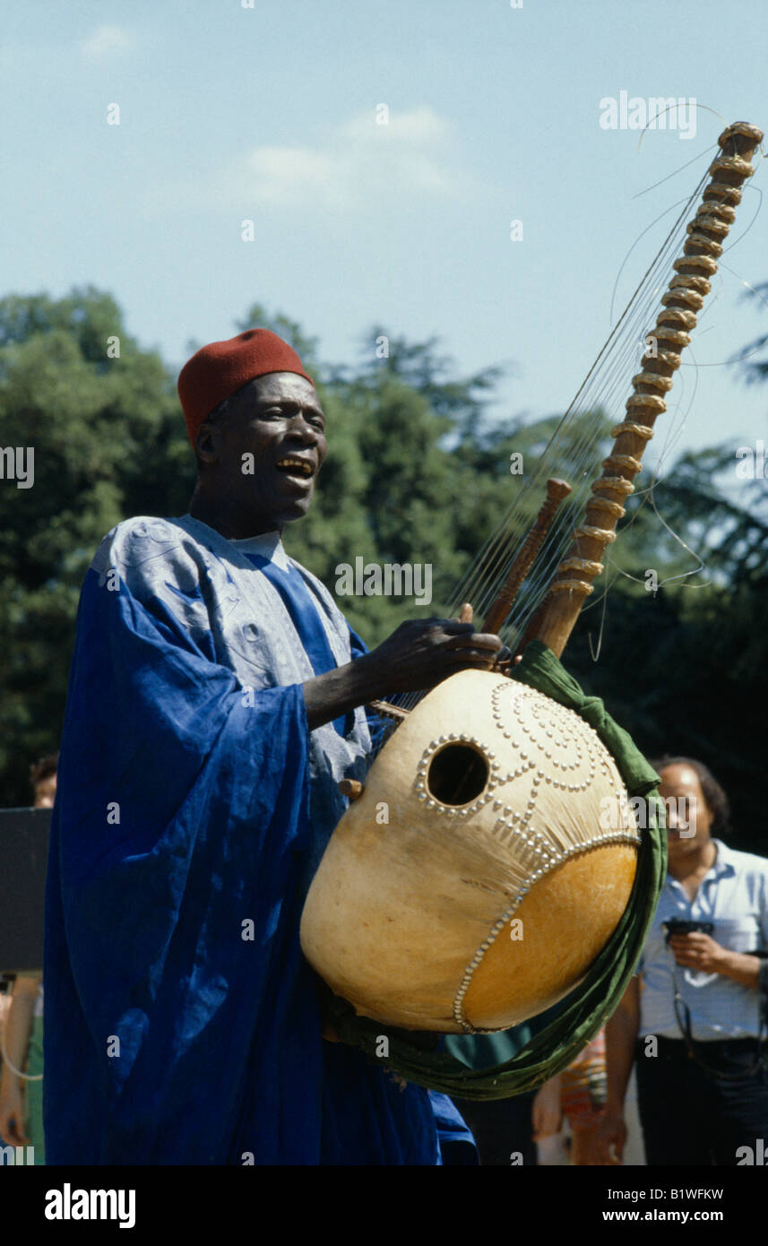 SENEGAL West Africa Music Manoinka musician playing the Kora a strung gourd  instrument Stock Photo - Alamy