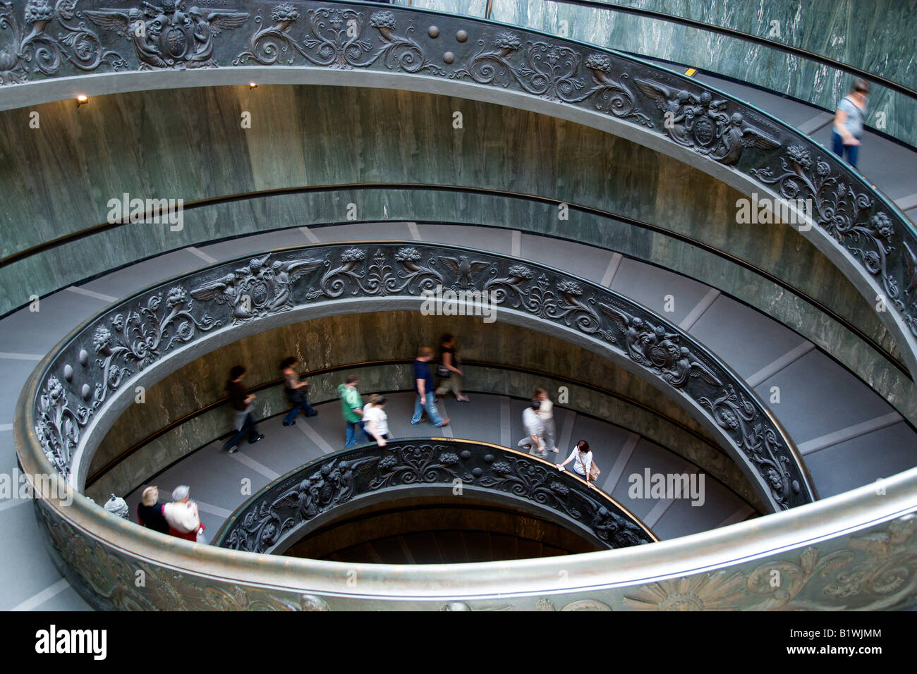 ITALY Lazio Rome Vatican City People descending the spiral ramp from the Museum to the street designed in 1932 by Guiseppe Momo Stock Photo