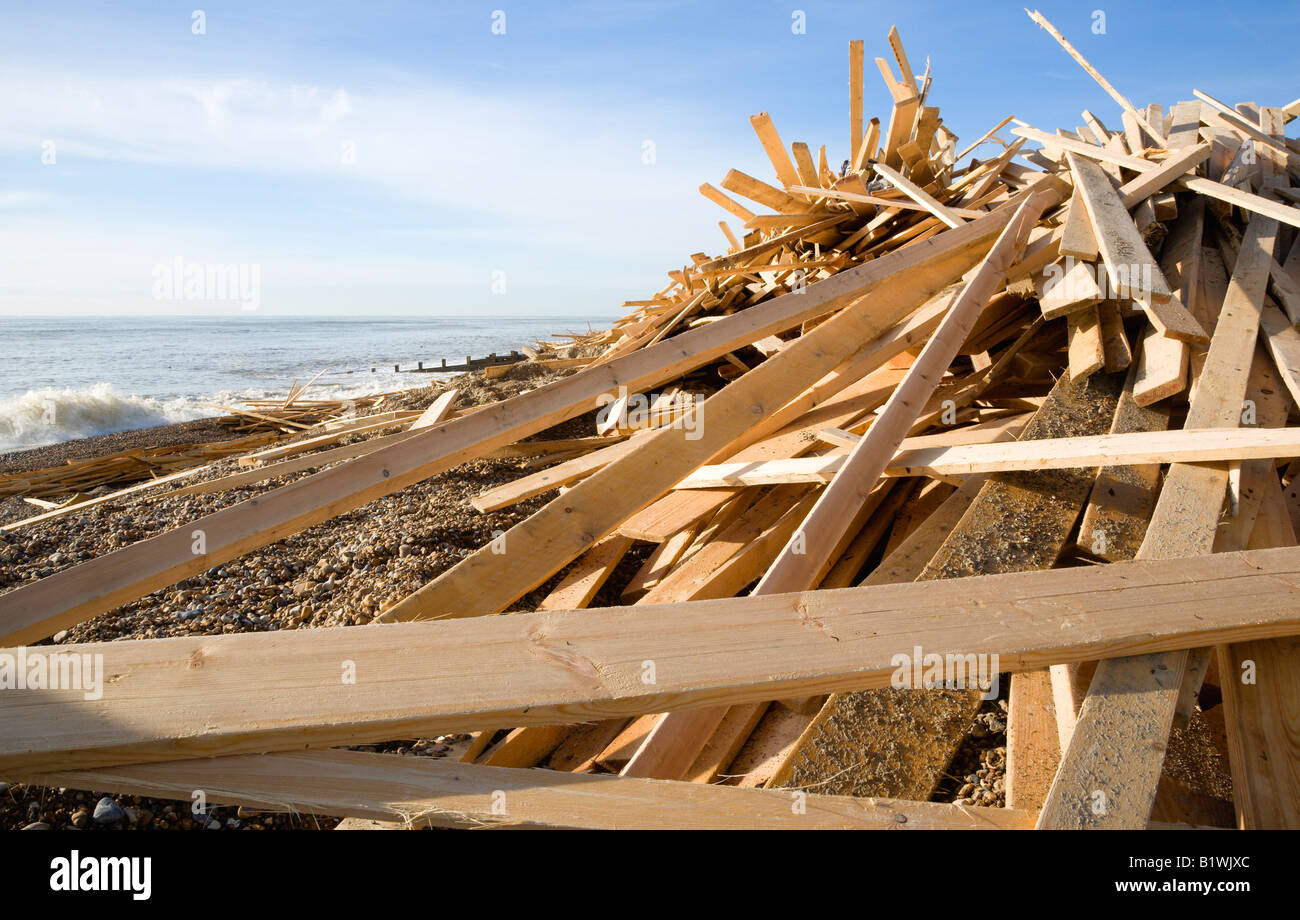 ENGLAND West Sussex Worthing Timber debris on beach from shipwrecked Ice Princess with waves breaking on shore Stock Photo