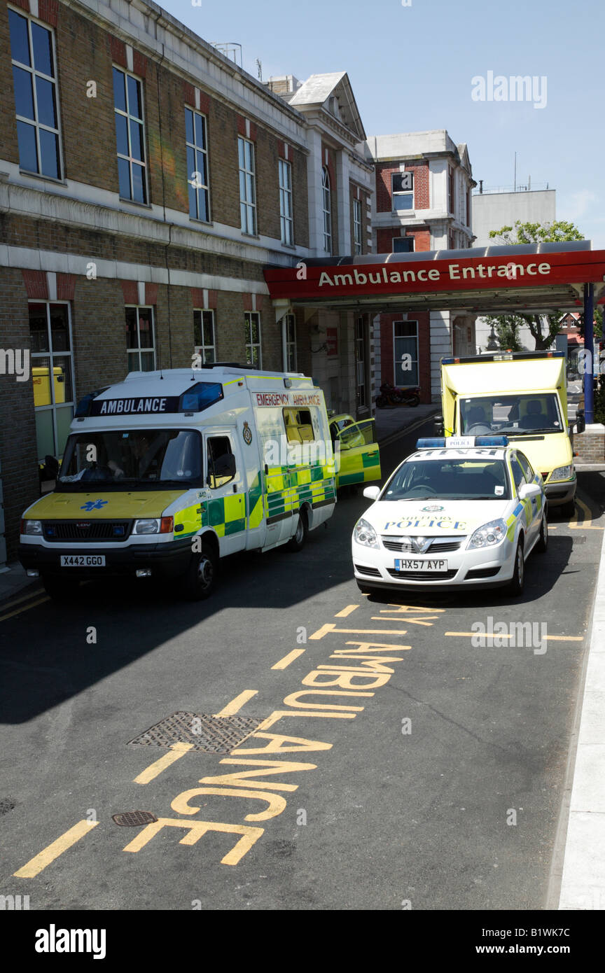 Ambulances and a military police vehicle parked outside the Emergency Department of King's College Hospital, Denmark Hill,London Stock Photo