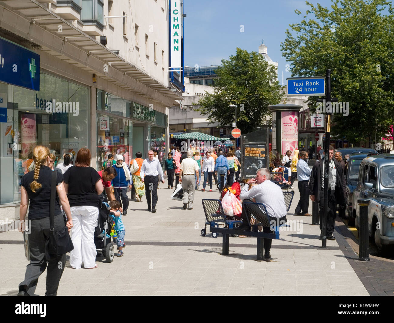 A busy shopping street in Birmingham City Centre, West Midlands UK ...
